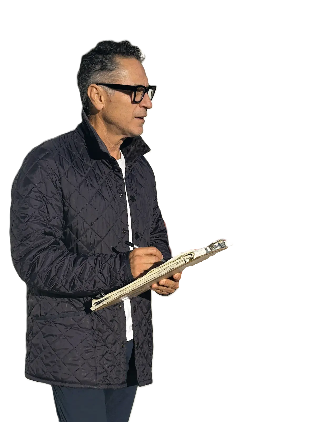 Carlos Ricardo working on a concrete project holding a clipboard