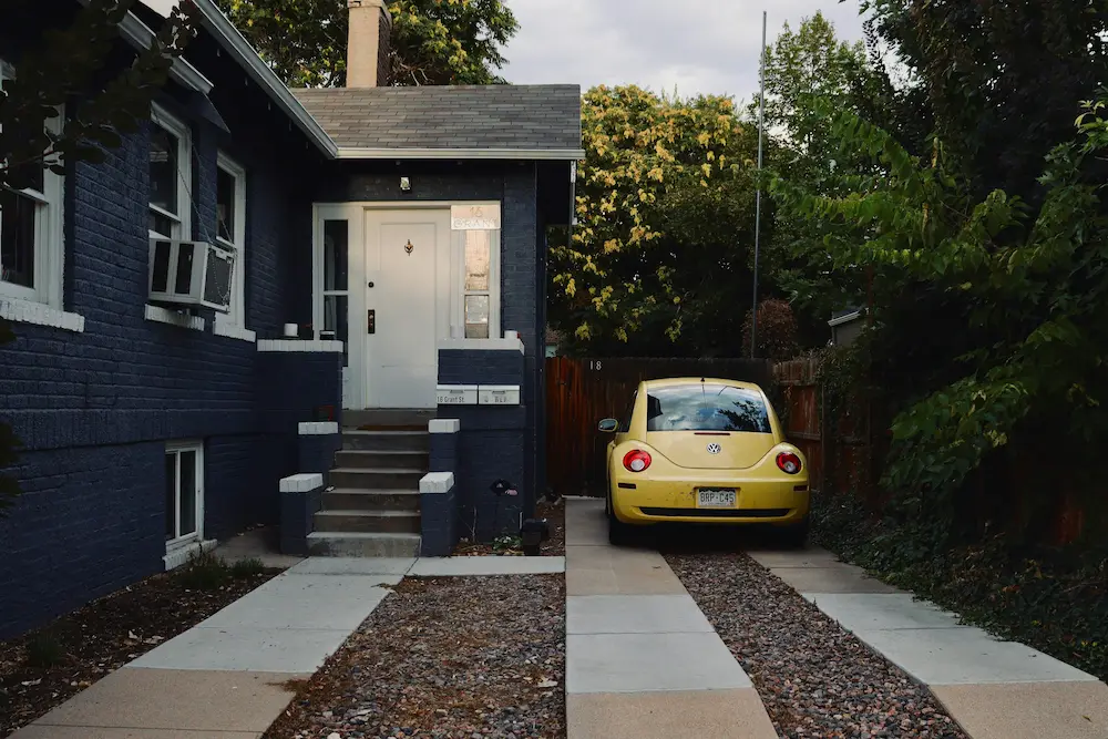 Newly installed concrete driveway with car parked in Upper Arlington home