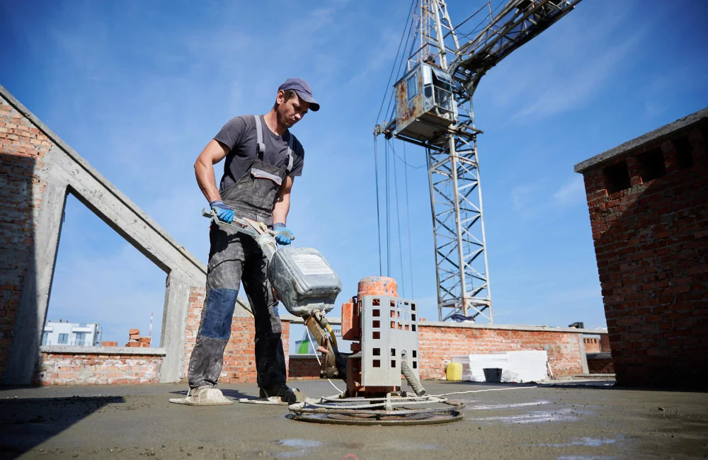 Freshly poured concrete curing process on construction site
